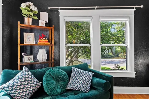 a living room with a couch and a window