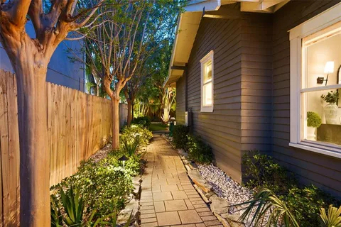 a view of a house with a backyard