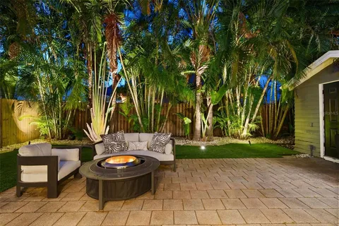 a view of swimming pool with a table and chairs