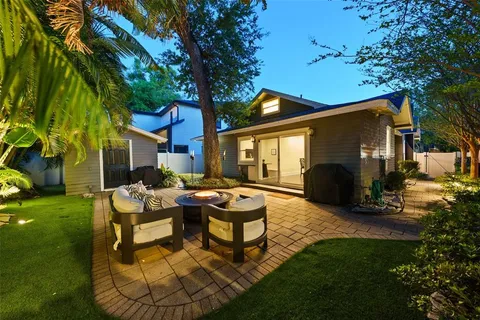 a backyard of a house with seating space