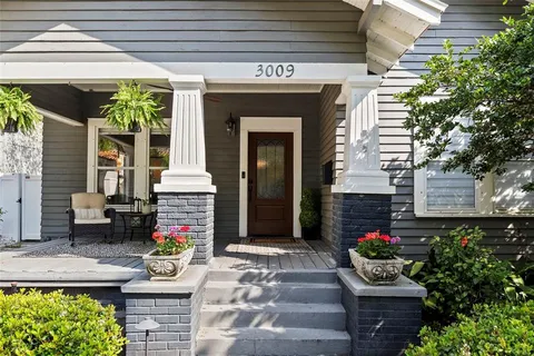 a front view of a house with a porch