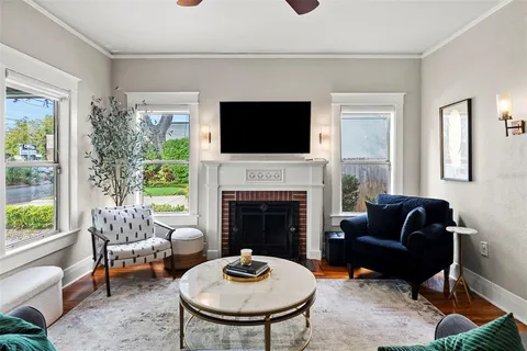 a living room with furniture and a fireplace