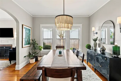 a view of a dining room with furniture window and wooden floor