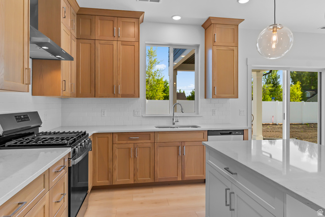 1237 West 500 South, Unit 230 Logan, UT 84321 - Photo 10 of 42 Kitchen featuring light wood-finish cabinetry, white subway tile backsplash, white countertops, and stainless steel appliances