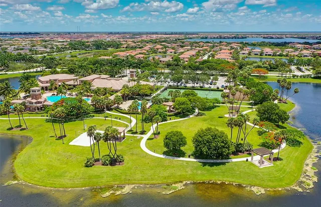 a view of a swimming pool with a yard
