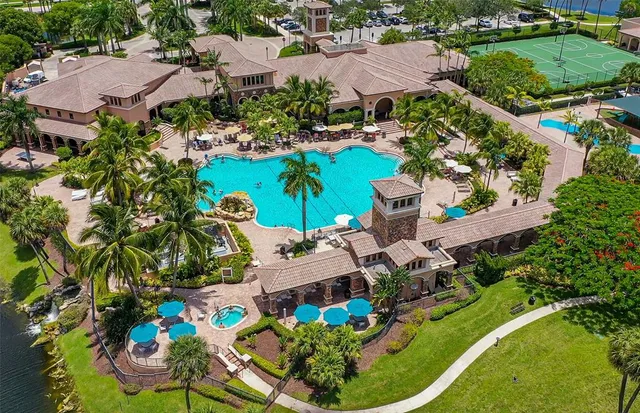 an aerial view of a house with garden space and outdoor seating