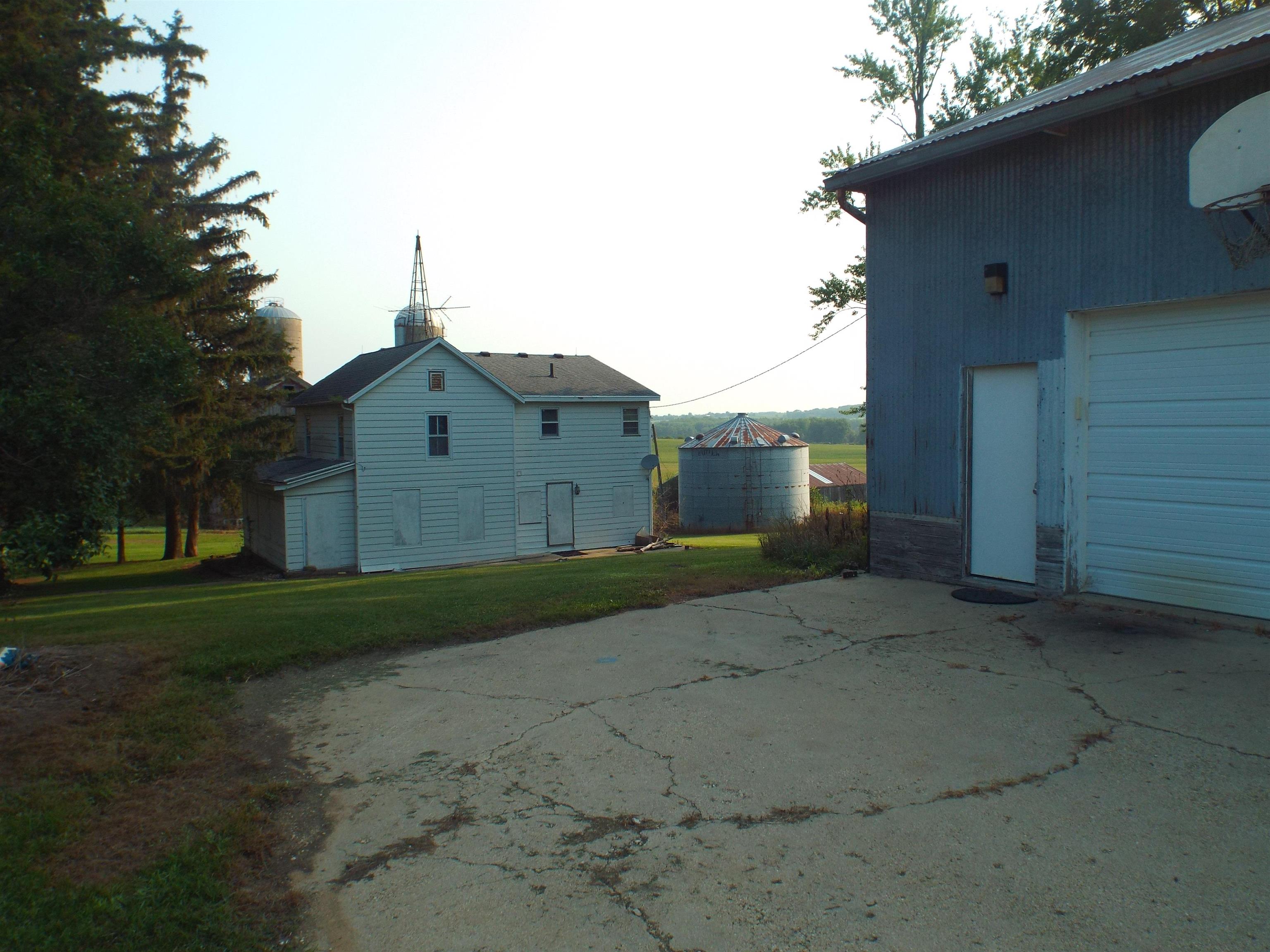 7225 North Scheider Road Freeport, IL 61032 - Photo 1 of 5 a front view of a house with a yard and garage