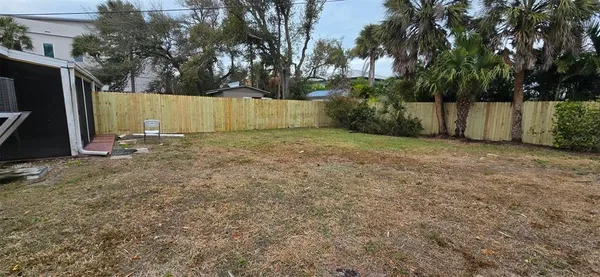 a backyard of a house with lots of green space