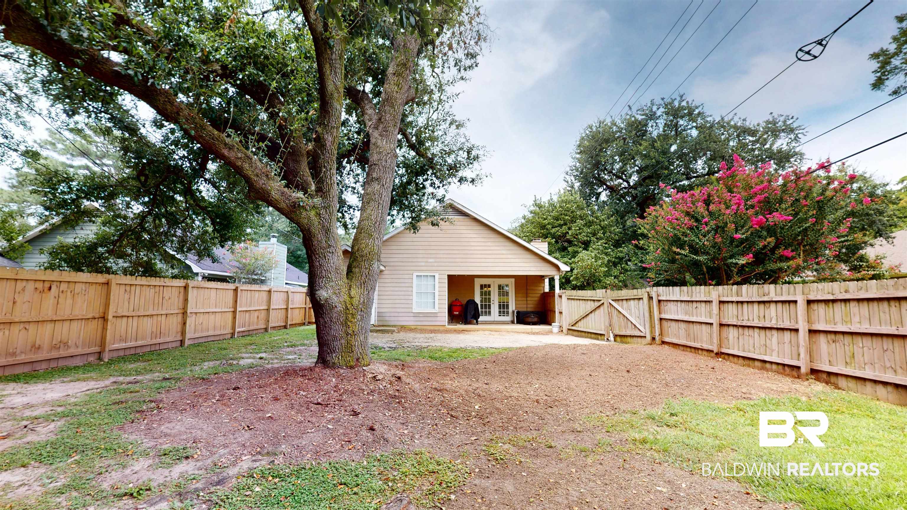 51 Bishop Lane South Mobile, AL 36608 - Photo 18 of 19 Rear view of house featuring a patio, french doors, and a fenced backyard