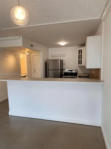 a view of a kitchen with a sink