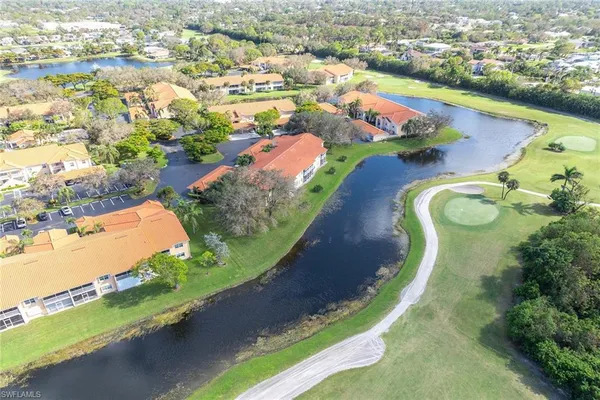 an aerial view of residential houses with outdoor space and street view