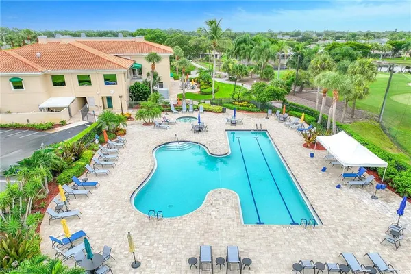 a view of a swimming pool with a yard