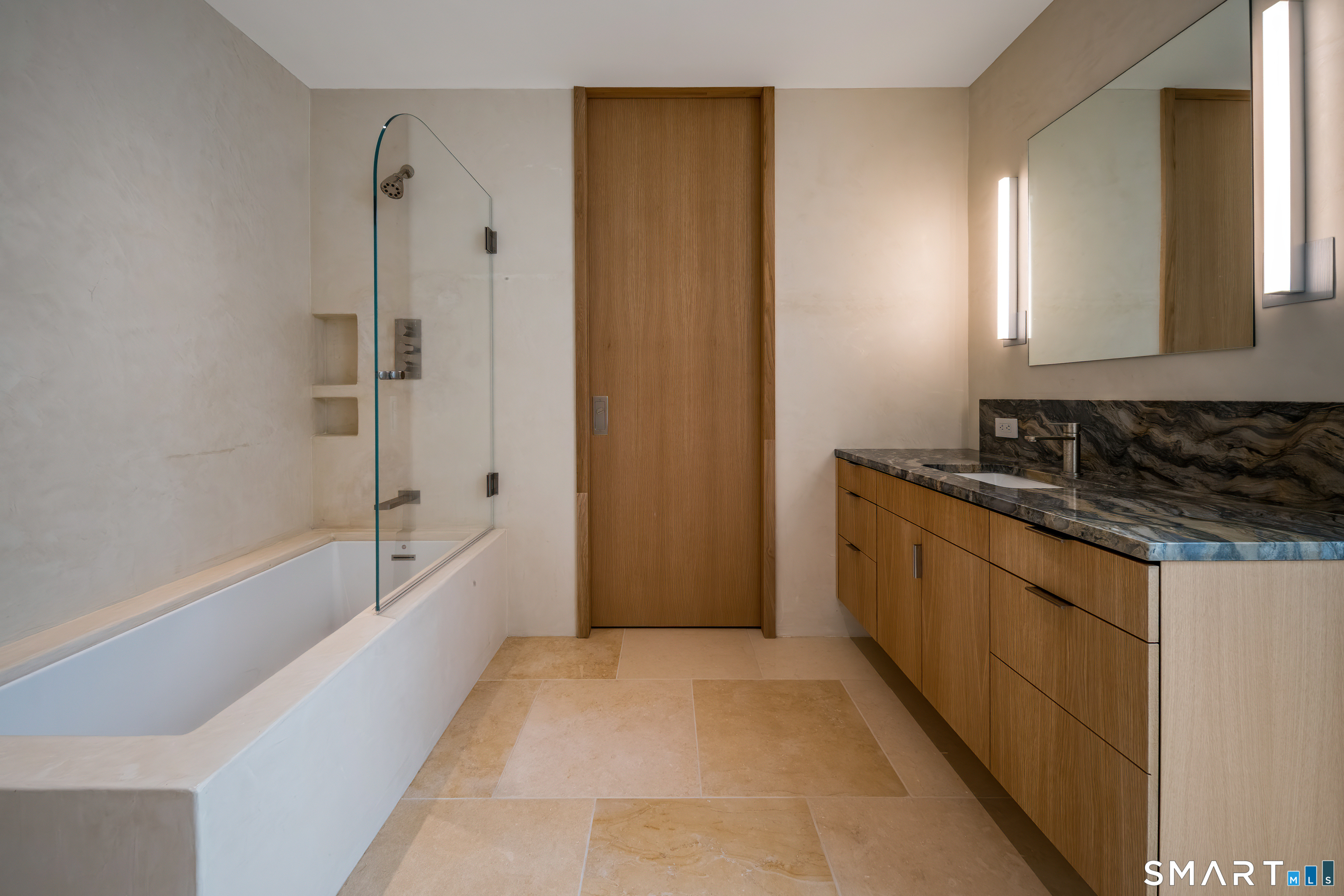 314 Ferry Road Old Lyme, CT 06371 - Photo 24 of 39 a spacious bathroom with a tub sink and mirror