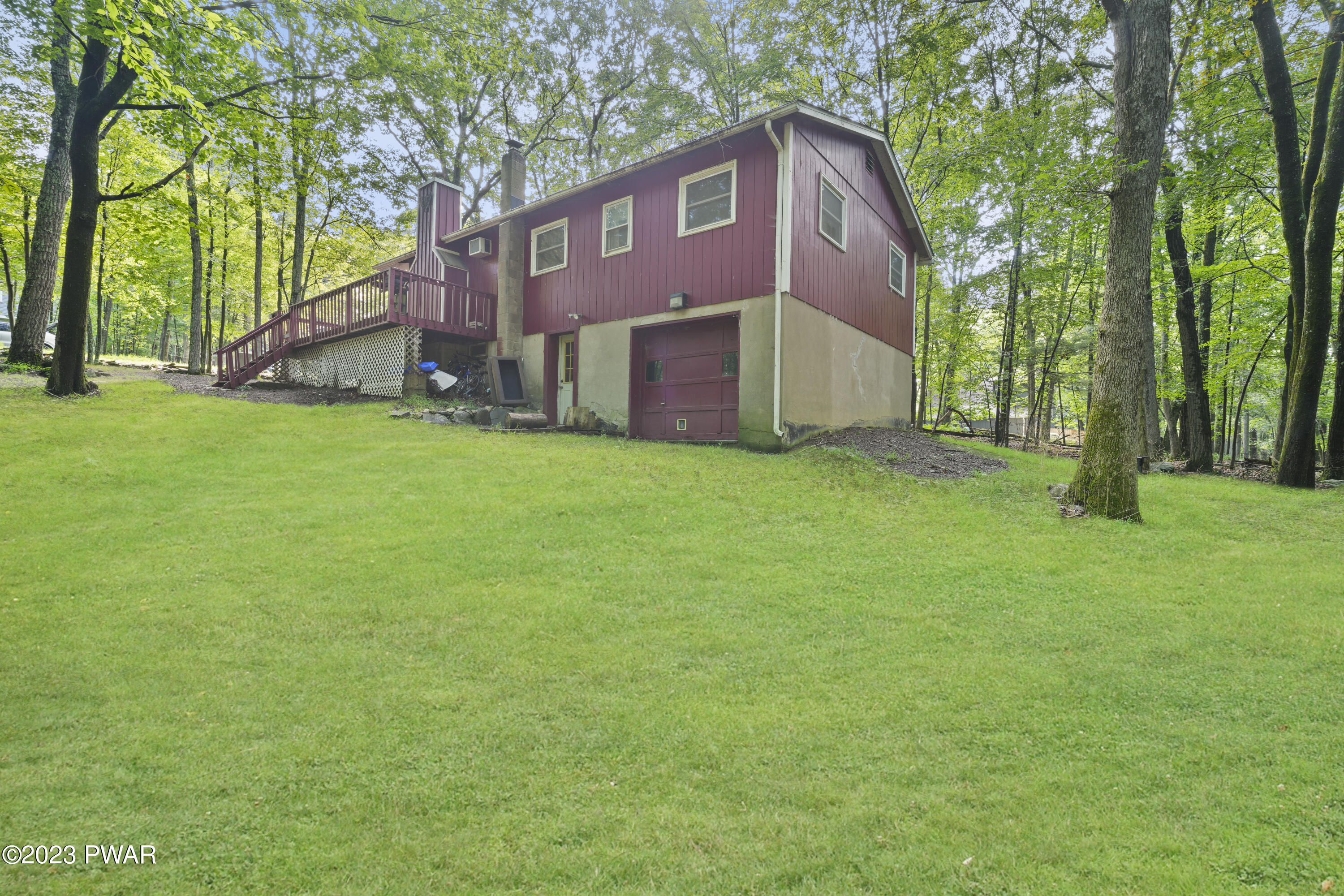 161 Butternut Road Milford, PA 18337 - Photo 5 of 26 a front view of a house with a yard and trees