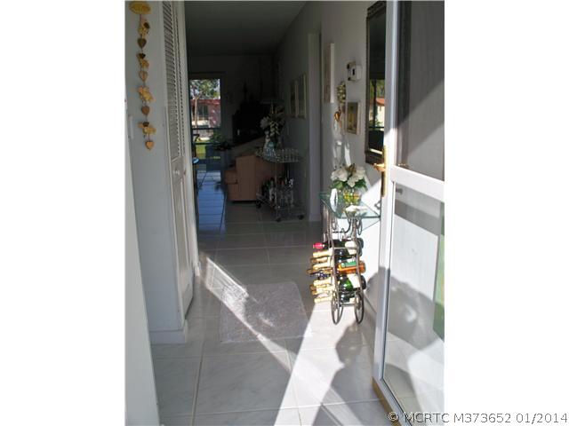 1919 Southwest Palm City Road, Unit 10J Stuart, FL 34994 - Photo 3 of 25 Other. Screen glass entry door and tiled foyer