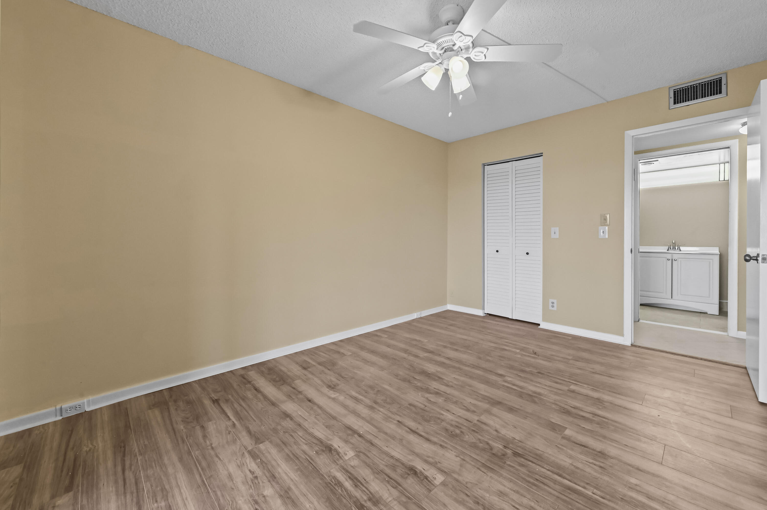 3046 Newcastle A Boca Raton, FL 33434 - Photo 14 of 25 wooden floor in an empty room