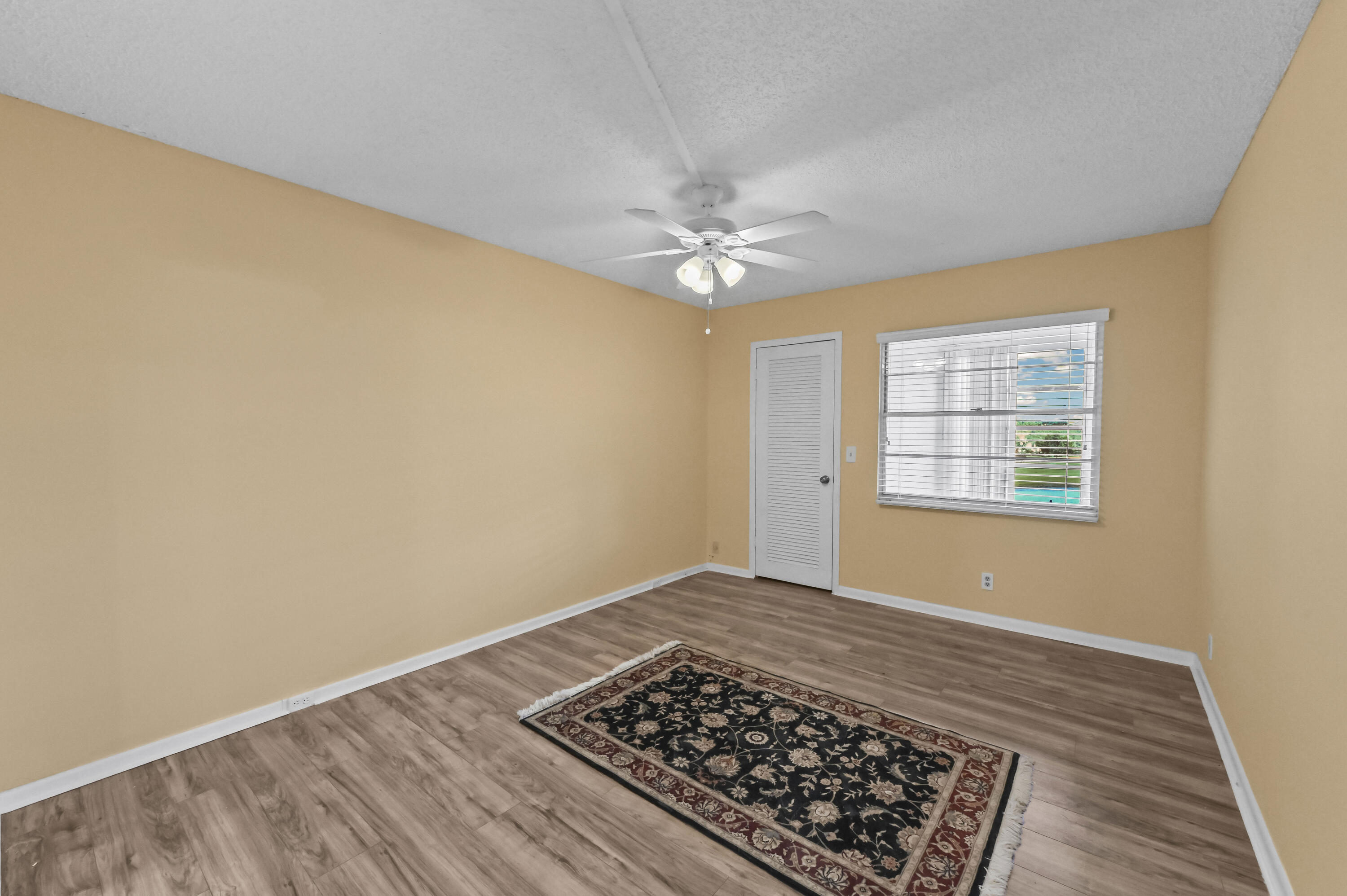 3046 Newcastle A Boca Raton, FL 33434 - Photo 16 of 25 an empty room with windows