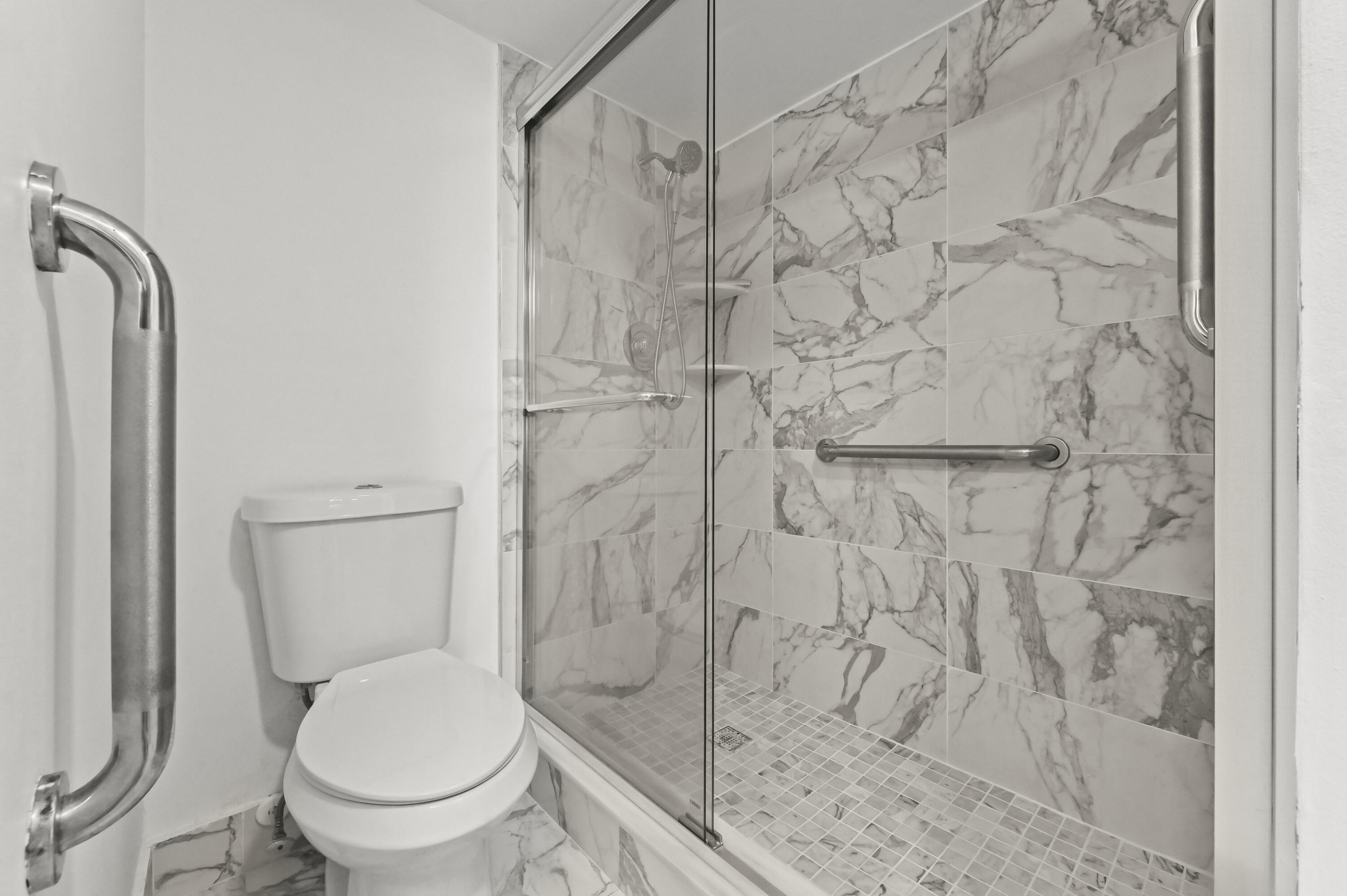 3046 Newcastle A Boca Raton, FL 33434 - Photo 20 of 25 a white toilet sitting next to a shower