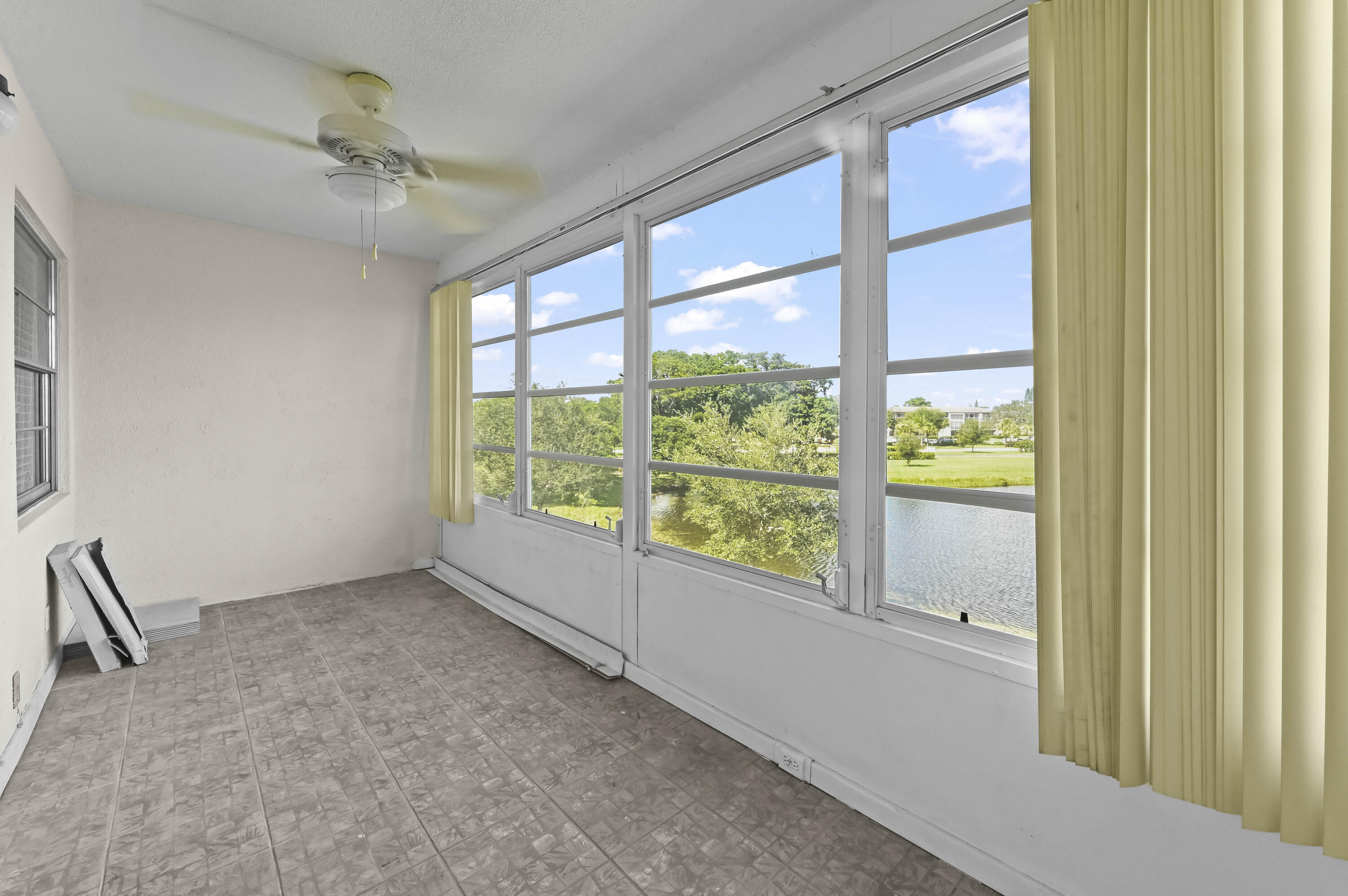 3046 Newcastle A Boca Raton, FL 33434 - Photo 21 of 25 a view of an empty room with a window
