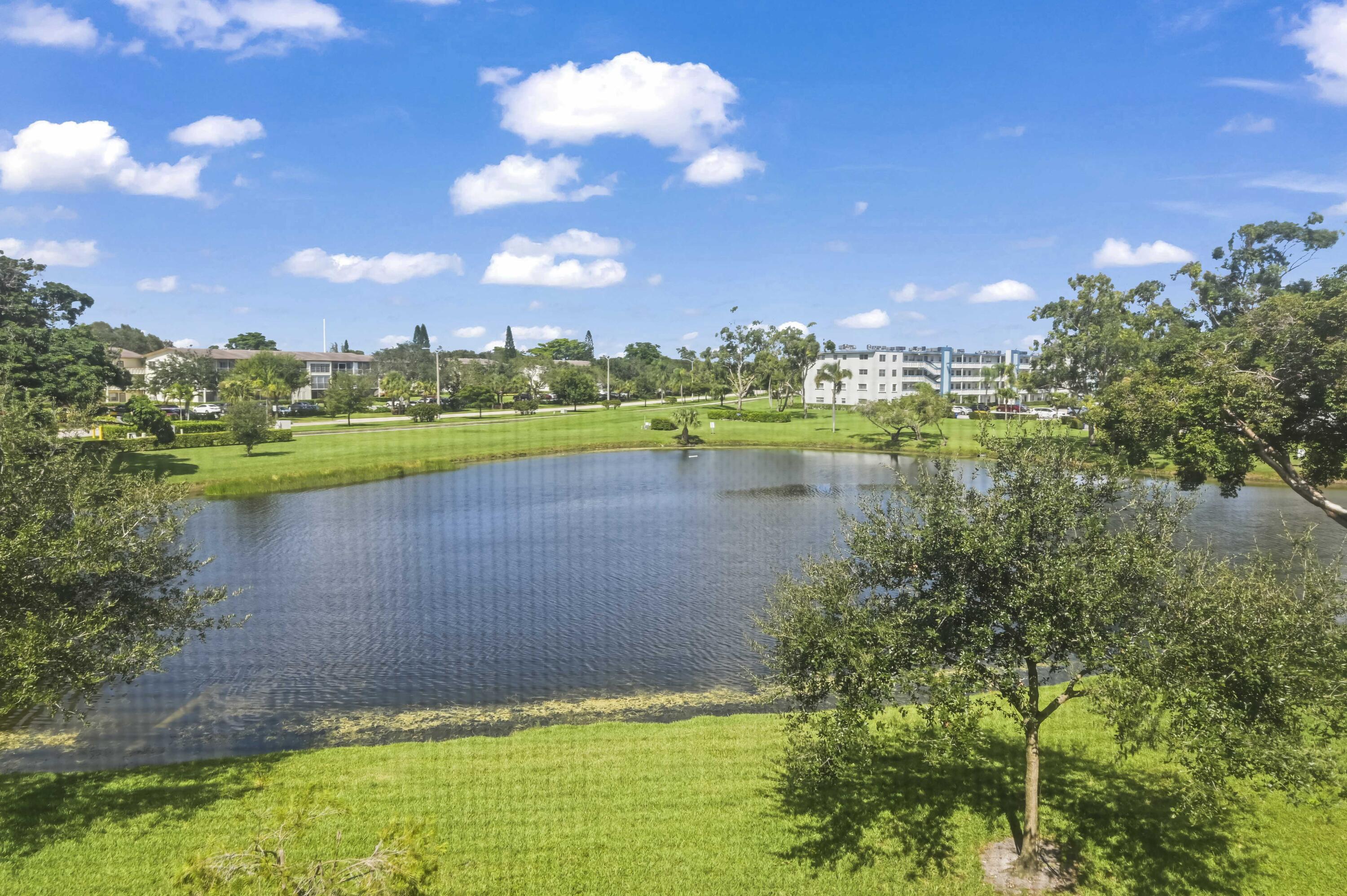 3046 Newcastle A Boca Raton, FL 33434 - Photo 23 of 25 a view of a lake with a city