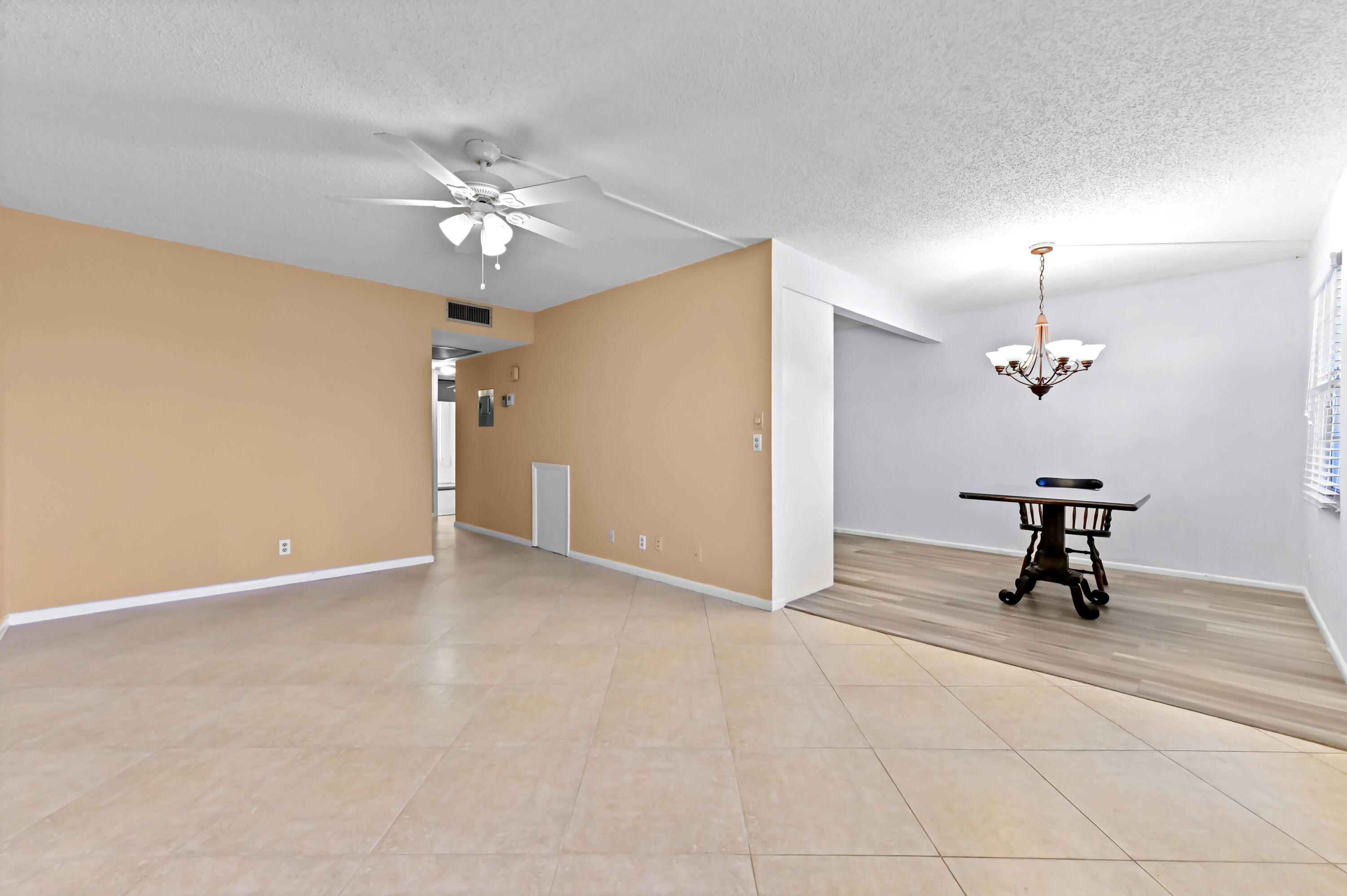 3046 Newcastle A Boca Raton, FL 33434 - Photo 7 of 25 an empty room with windows and fan