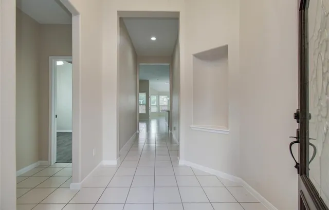 a view of an empty room and closet area