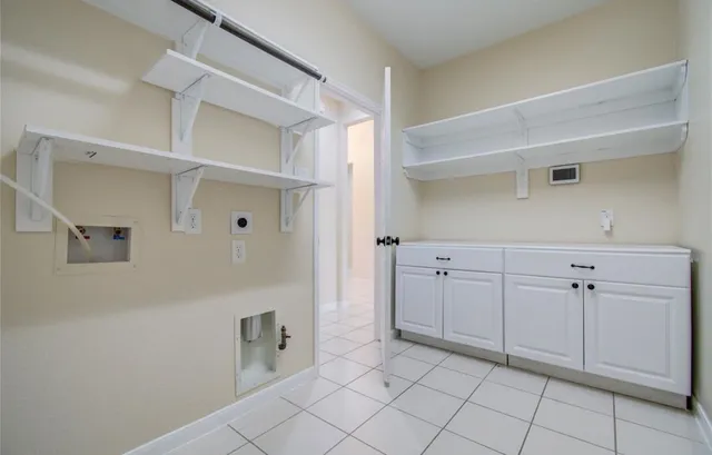 a spacious bathroom with a glass shower door