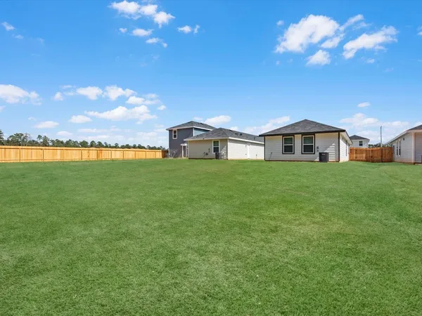 a view of a house with a big yard