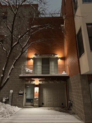 a view of a building with a snow in the middle of a city
