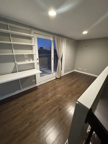 a large kitchen with stainless steel appliances granite countertop a stove a sink and a refrigerator