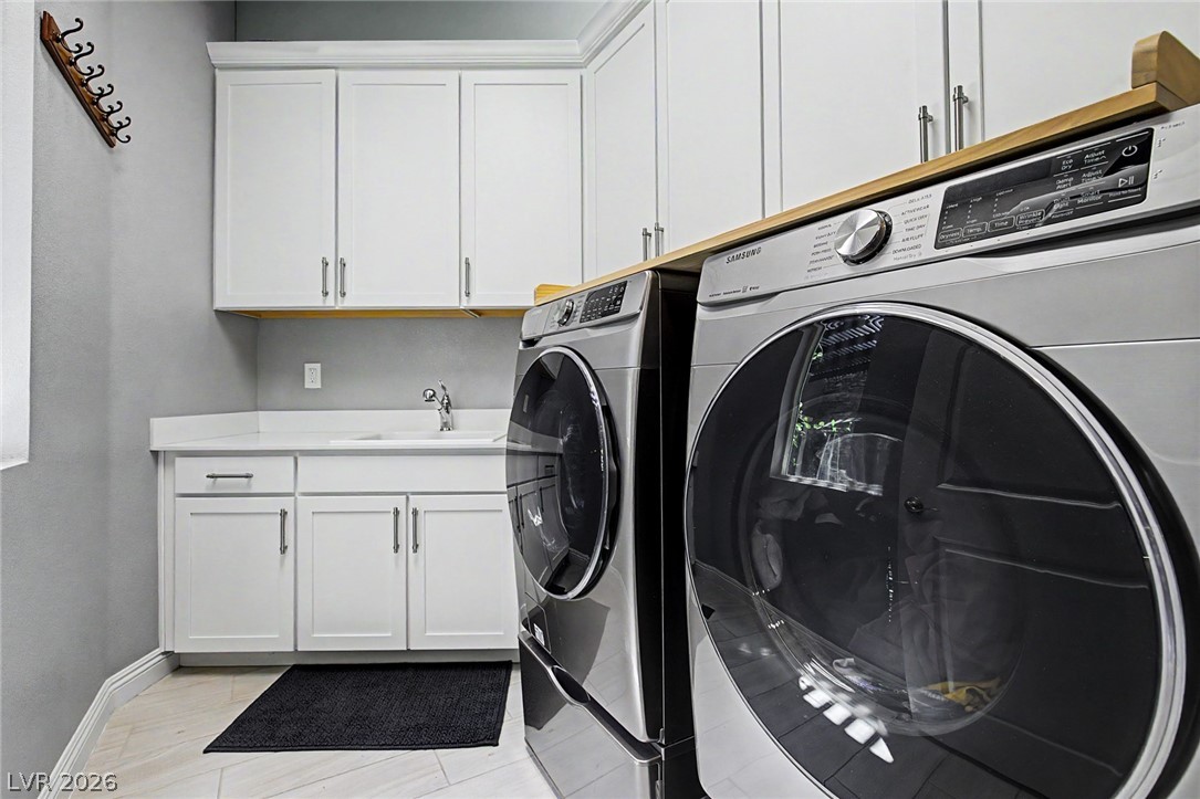 6014 Willow Ridge Court Las Vegas, NV 89135 - Photo 63 of 99 This thoughtfully designed laundry room offers convenience and ample storage.