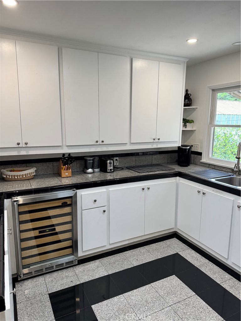 155 Barhaven Lane Fallbrook, CA 92028 - Photo 12 of 43 a kitchen with granite countertop white cabinets and sink