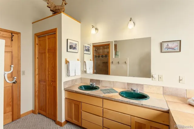 a backyard of a house with a yard and mountain view in back