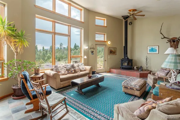 a living room with furniture and a rug