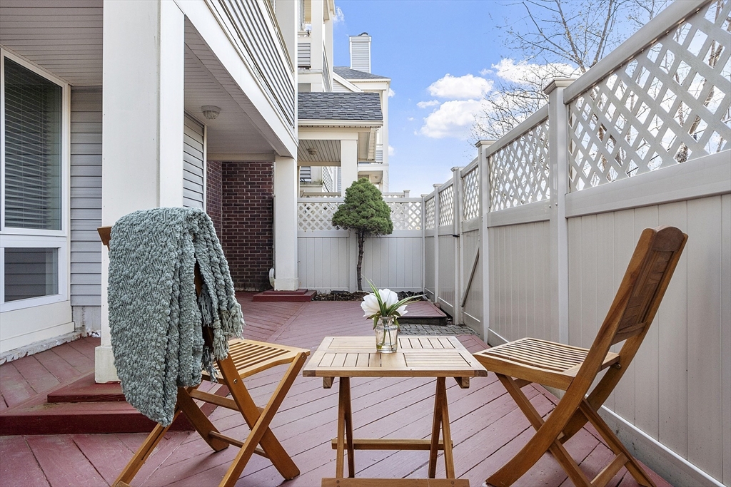 200 Falls Boulevard, Unit D108 Quincy, MA 02169 - Photo 22 of 30 a view of patio with a table and chairs