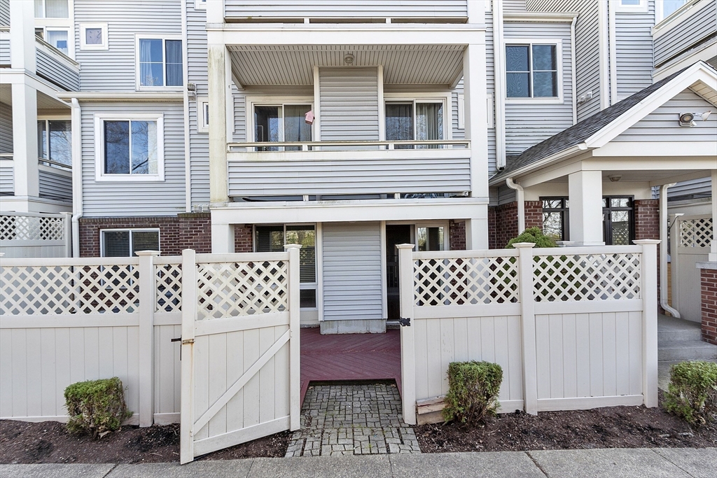 200 Falls Boulevard, Unit D108 Quincy, MA 02169 - Photo 24 of 30 a front view of a house with plants