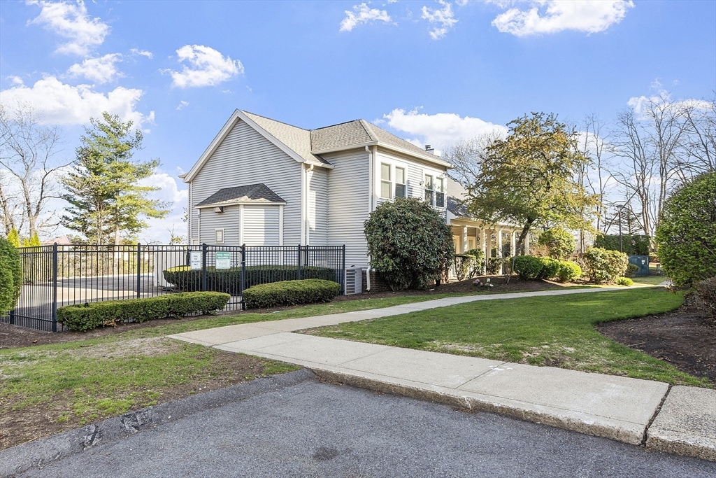 200 Falls Boulevard, Unit D108 Quincy, MA 02169 - Photo 28 of 30 a front view of a house with garden