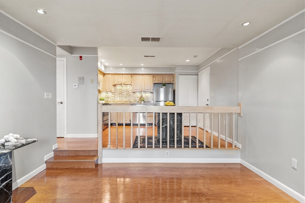 200 Falls Boulevard, Unit D108 Quincy, MA 02169 - Photo 6 of 30 a view of entryway with wooden floor