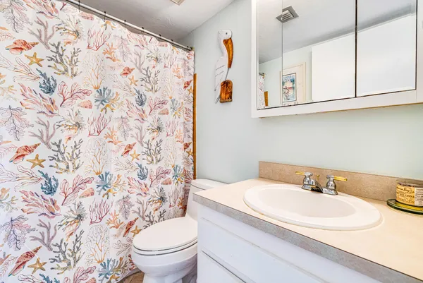 a bath room with a bench and a porch