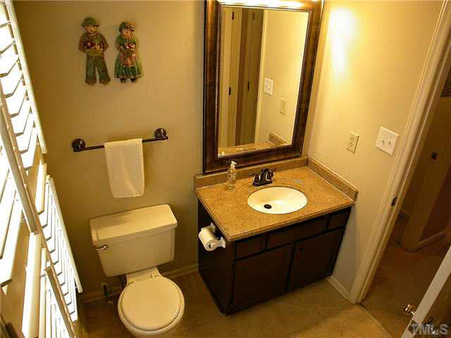 5403 Middleton Road Durham, NC 27713 - Photo 13 of 20 a bathroom with a toilet sink and mirror