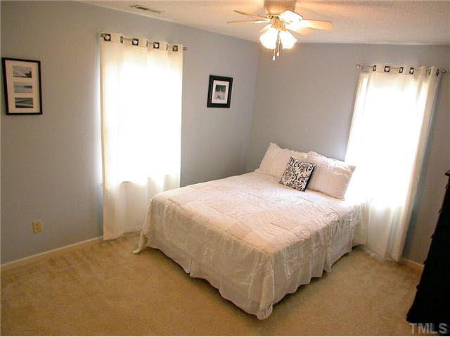 5403 Middleton Road Durham, NC 27713 - Photo 16 of 20 a bedroom with a bed and a window