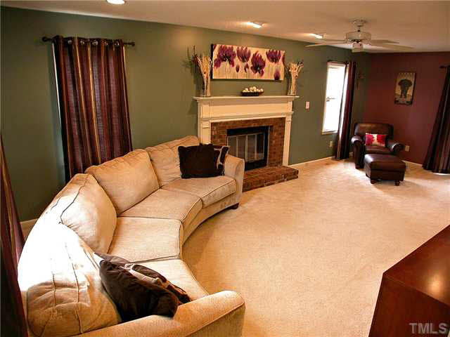 5403 Middleton Road Durham, NC 27713 - Photo 6 of 20 a living room with furniture and a fireplace