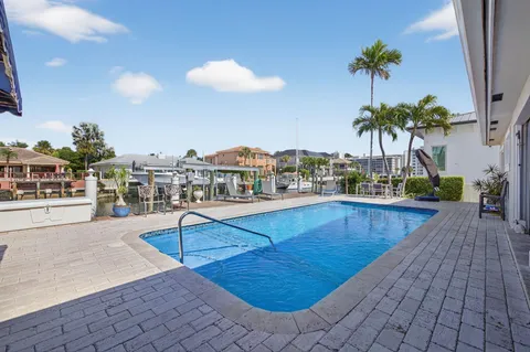 a view of a patio with a table and chairs
