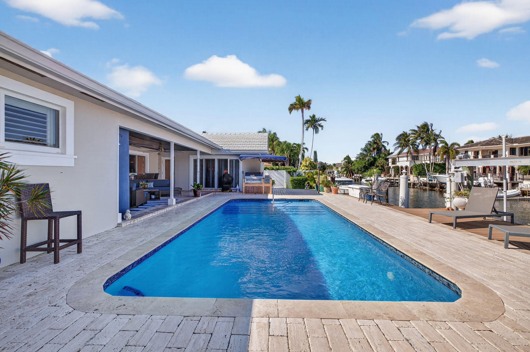 885 Nafa Drive Boca Raton, FL 33487 - Photo 45 of 66 a swimming pool with outdoor seating and yard