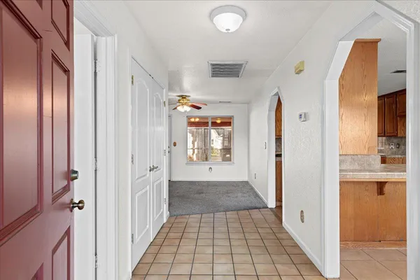 a kitchen with granite countertop cabinets stainless steel appliances a sink and a counter top space