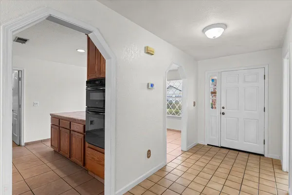 a kitchen with a stove and a microwave