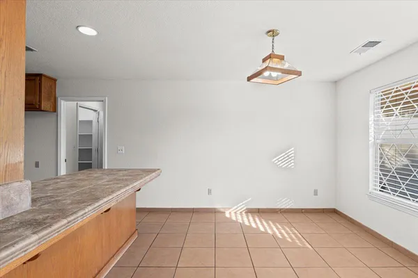 a kitchen with a sink dishwasher stove and cabinets