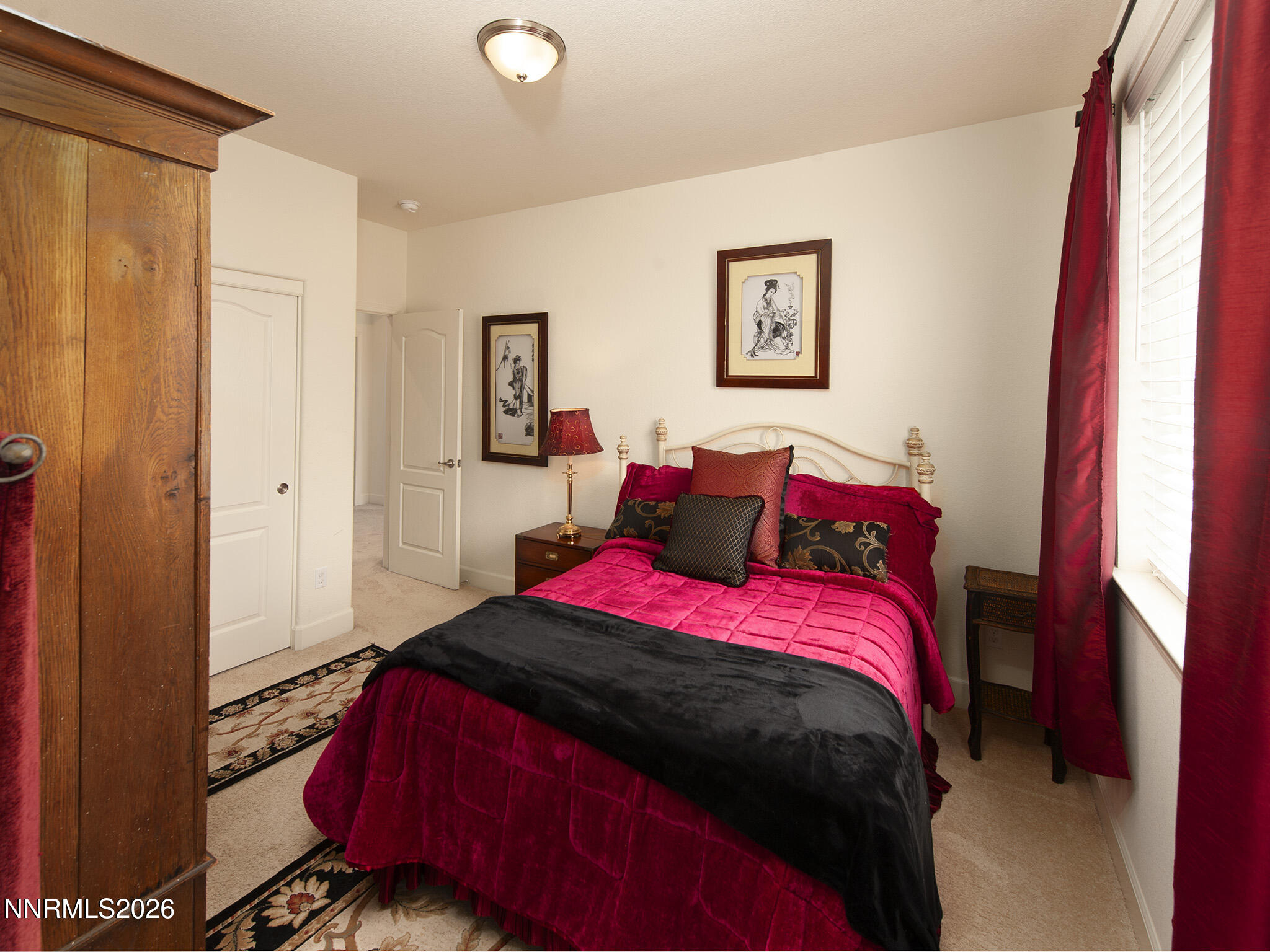 9766 Pachuca Drive Reno, NV 89521 - Photo 33 of 59 a bedroom with a bed and a window