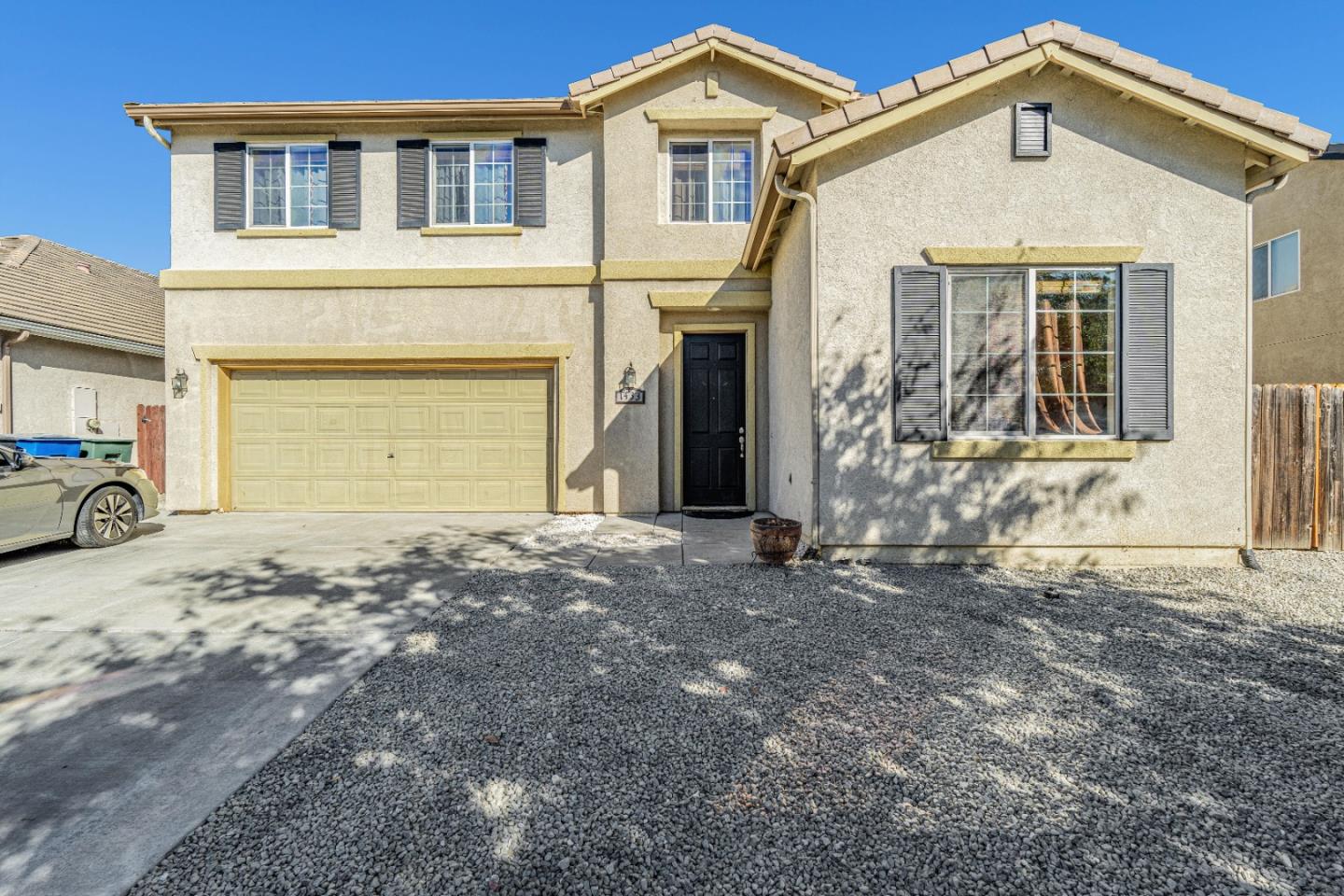 1433 Brahma Street Patterson, CA 95363 - Photo 1 of 43 a front view of a house with a yard