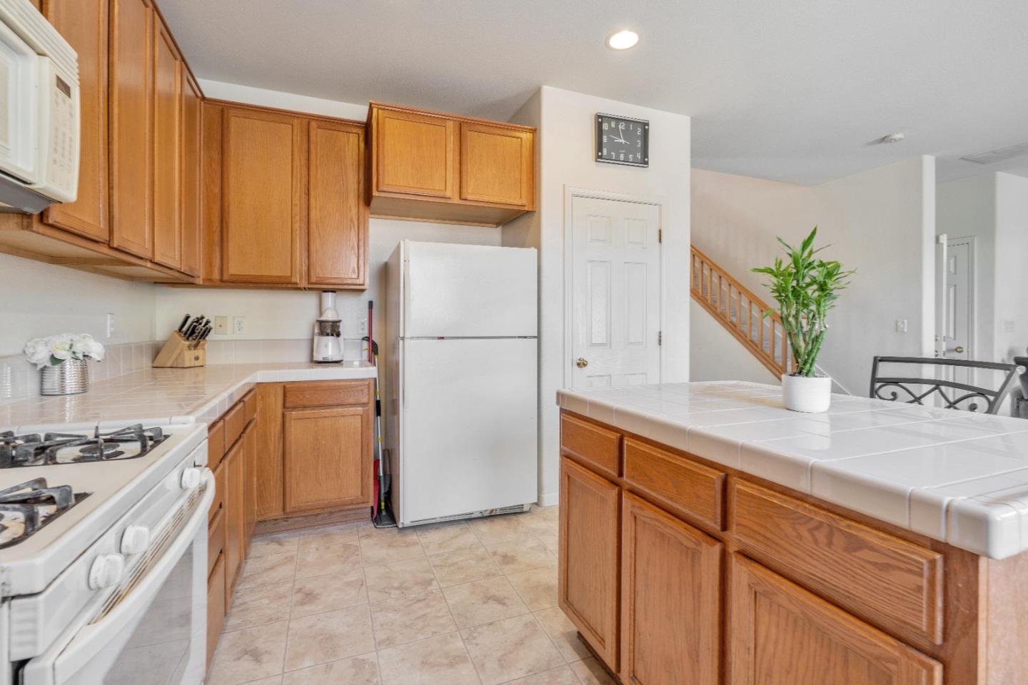 1433 Brahma Street Patterson, CA 95363 - Photo 13 of 43 a kitchen with stainless steel appliances granite countertop a refrigerator sink and stove